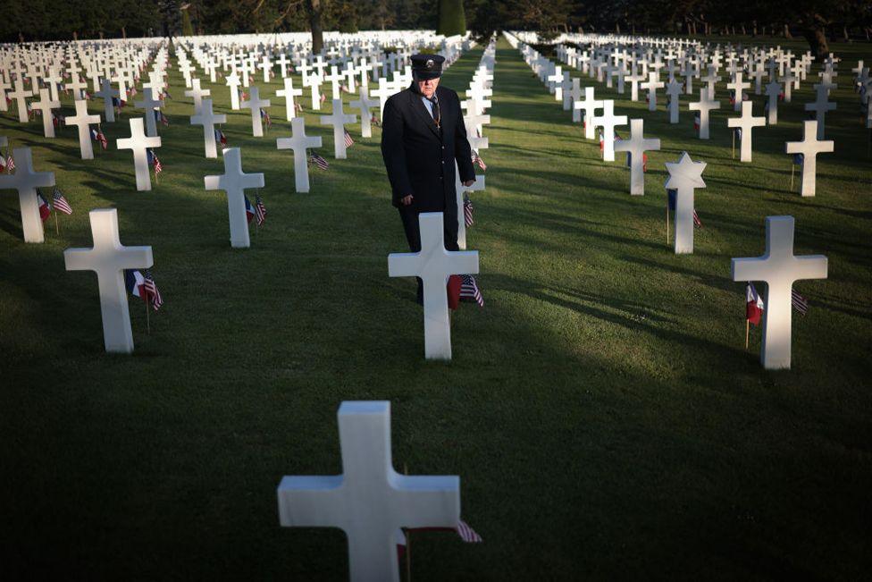 Visitors pay their respects at the Normandy American Cemetery above Omaha Beach on the 80th anniversary of D-Day on June 06, 2024 in Colleville-sur-Mer, France. 