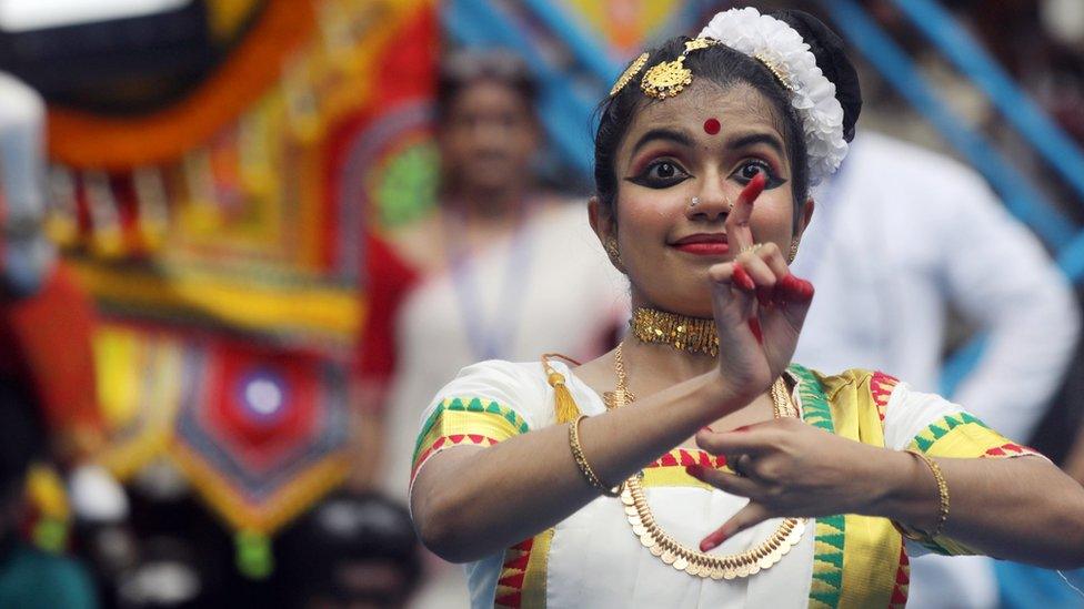 a holy dance near a holy chariot bearing Lord Jagannatha during Rath Yatra, or the Chariot Journey Festival, in Kolkata, Eastern India