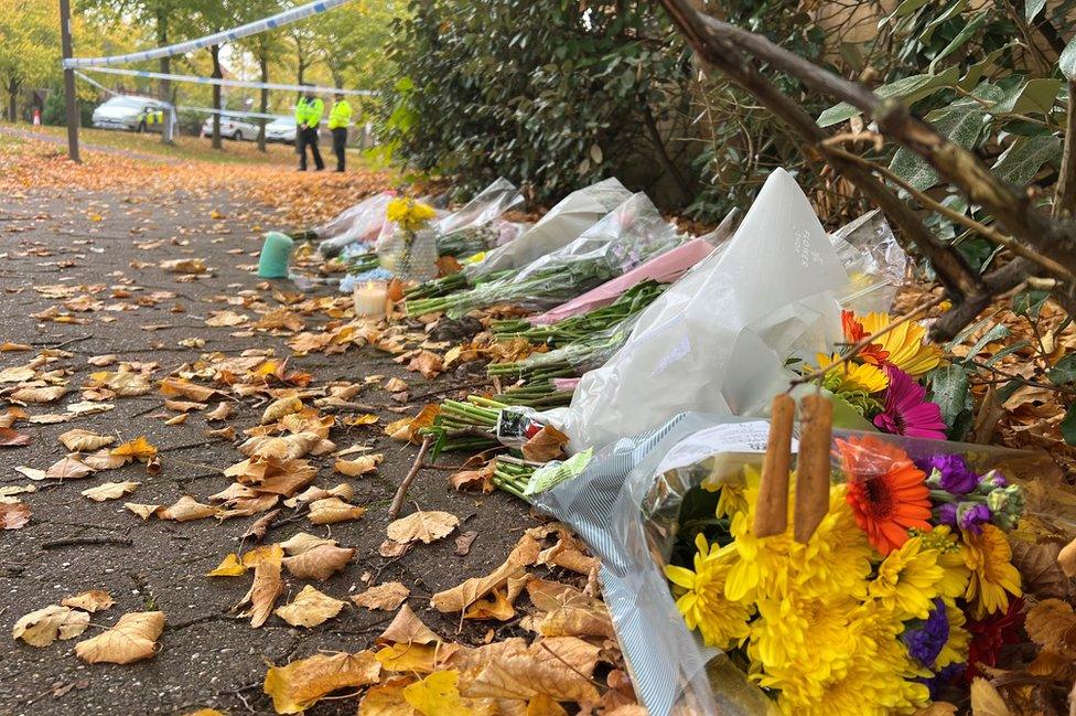 Flowers near police search at Loxbeare Drive in Furzton, Milton Keynes