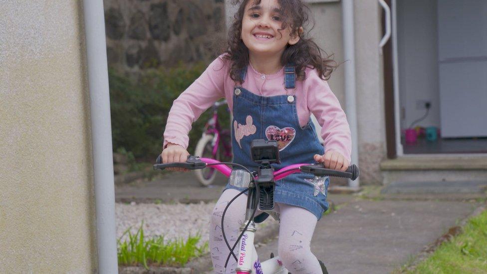 a girl on a bike