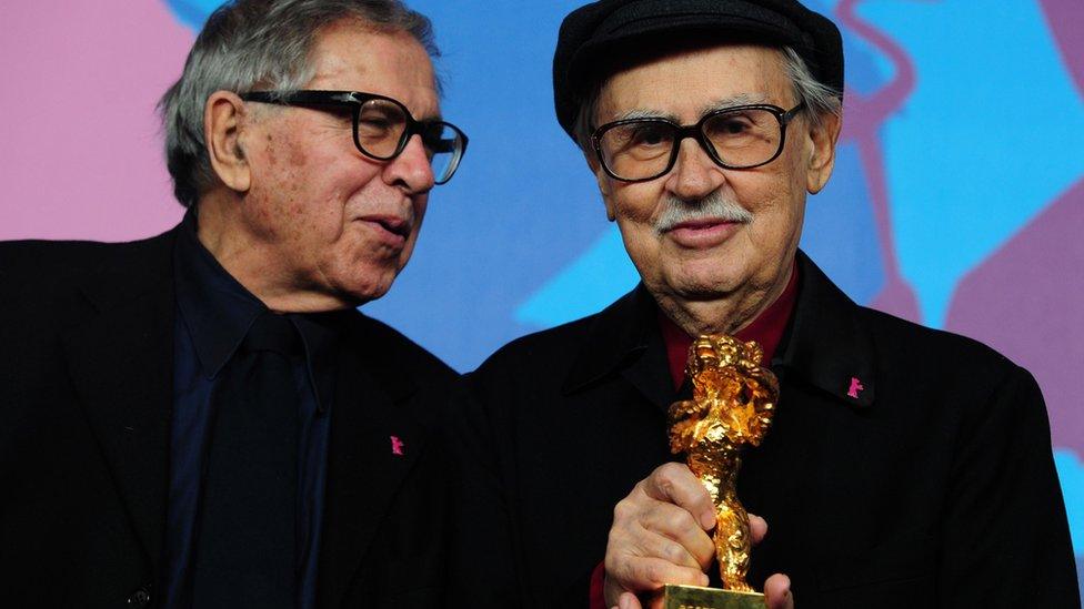 Italian directors Vittorio (R) and Paolo Taviani receive the Golden Bear prize awarded for their film "Caesar Must Die