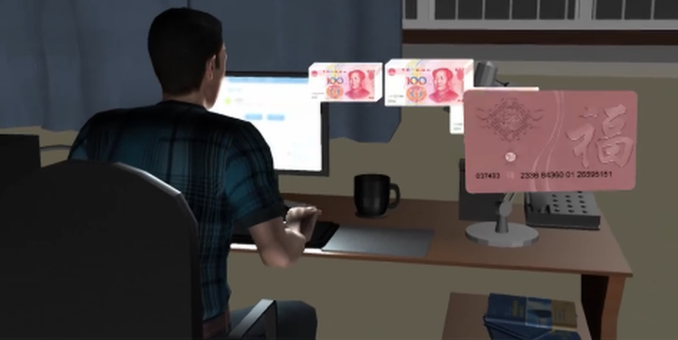 A screengrab from an animated video on the story shows a man at a computer with yuan notes being transferred onto the gift card