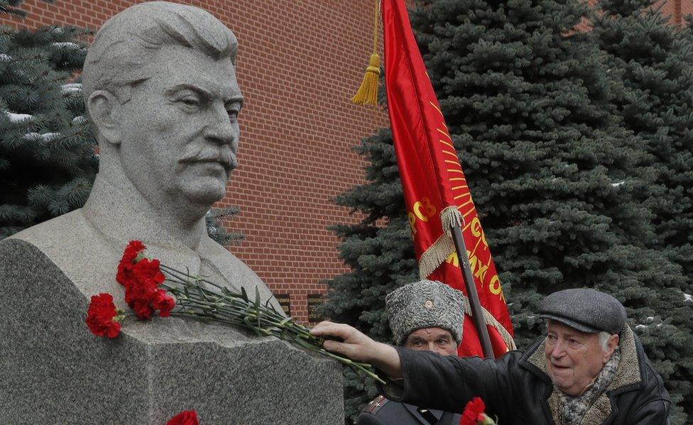 Stalin statue and Communist supporter at Kremlin, Dec 2017