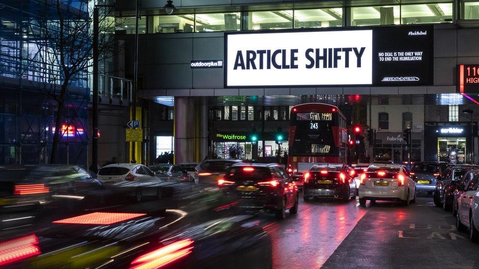 A billboard in Holborn reads "Article Shifty" - a play on Article 50