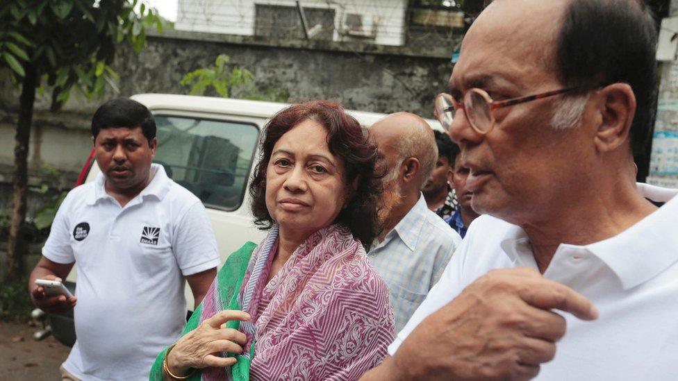 Razaul Karim, right, and Hosne Ara Karim, center, whose son and daughter-in-law were rescued from the restaurant attacked by heavily armed militants, wait for them in Dhaka, Bangladesh, Saturday, 2 July 2016.