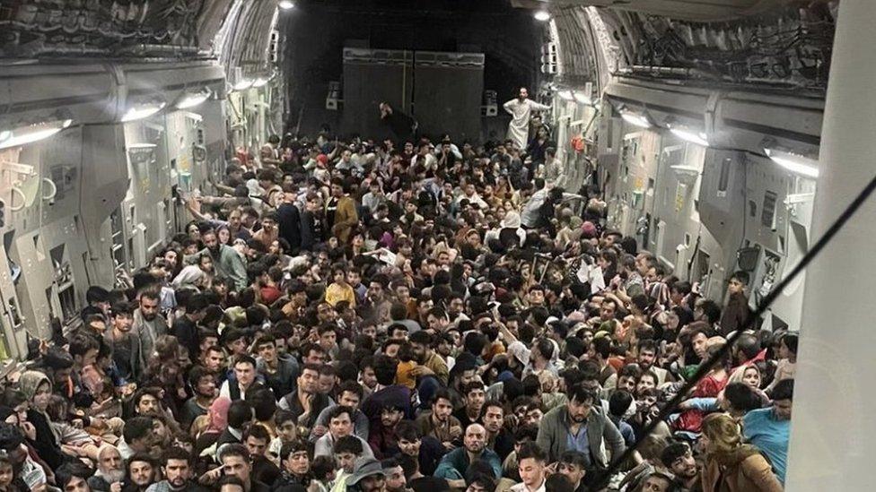 Picture provided Defense One appears to show hundreds of Afghans fleeing Kabul onboard an American C-17 cargo plane, 15 August 2021