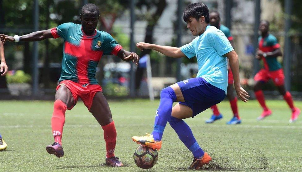 An action shot from a match between All Black FC and another Hong Kong team, Biu Chun Rangers