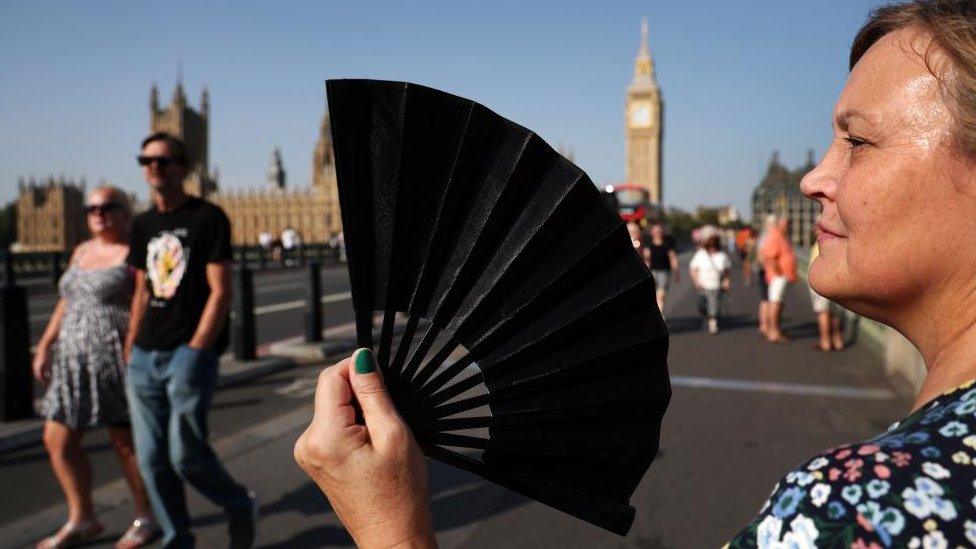 A woman fans herself in central London, Britain, 09 September 2023.