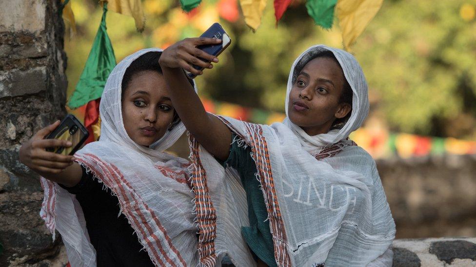 Women taking a selfie during the annual Timkat epiphany celebration in Gondar, Ethiopia - Wednesday 18 January 2017