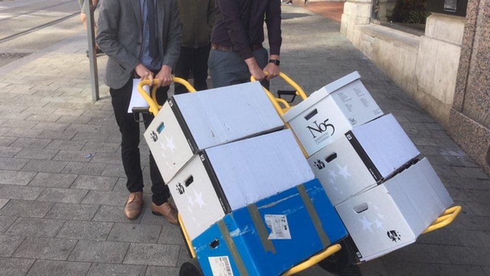 Cardoza case papers being delivered at the High Court in Birmingham.