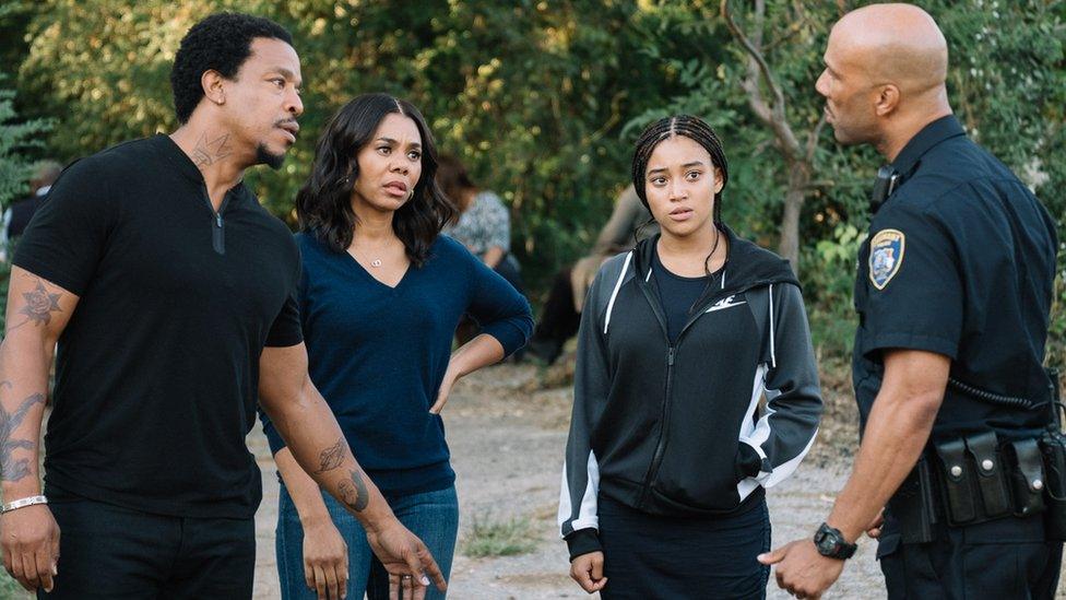 Amandla Stenberg (right) with other cast members in The Hate U Give