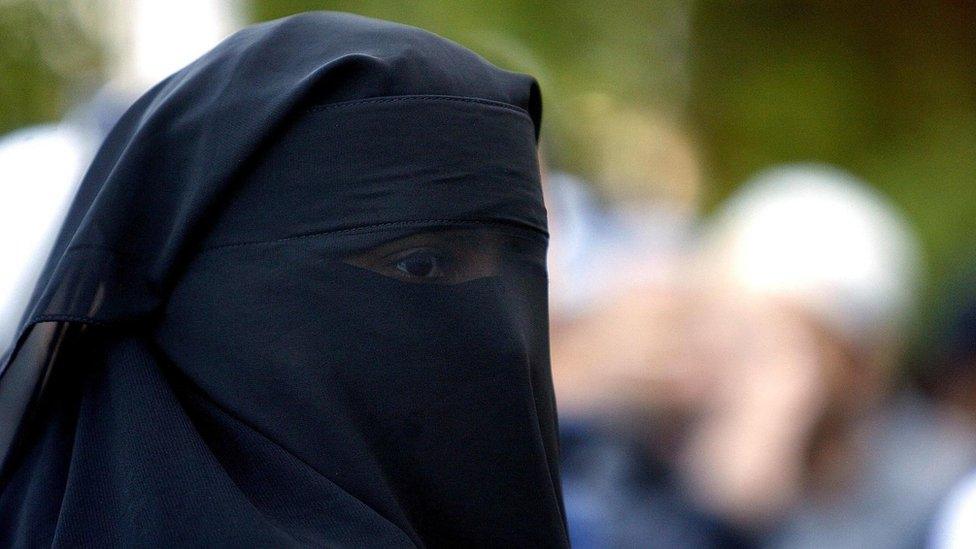 A Muslim woman with a face veil