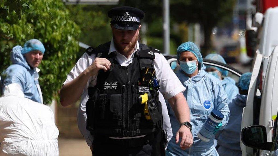 Police officer and forensic investigators