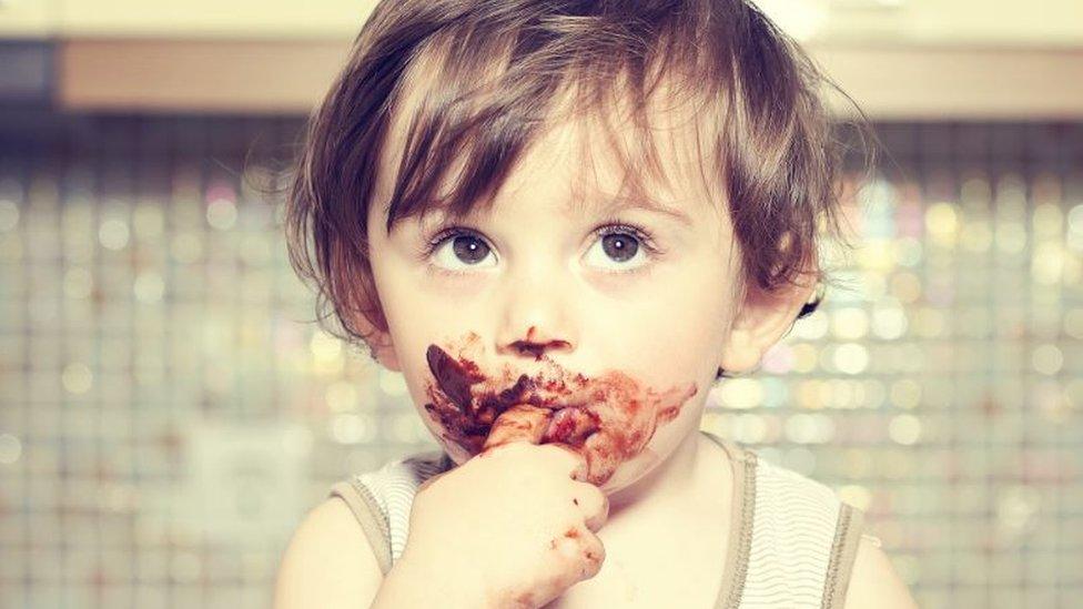 Baby eating chocolate