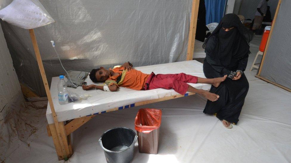 A woman sits next to her son who is infected with cholera at a hospital in the Red Sea port city of Hodeidah, Yemen, May 14, 2017.