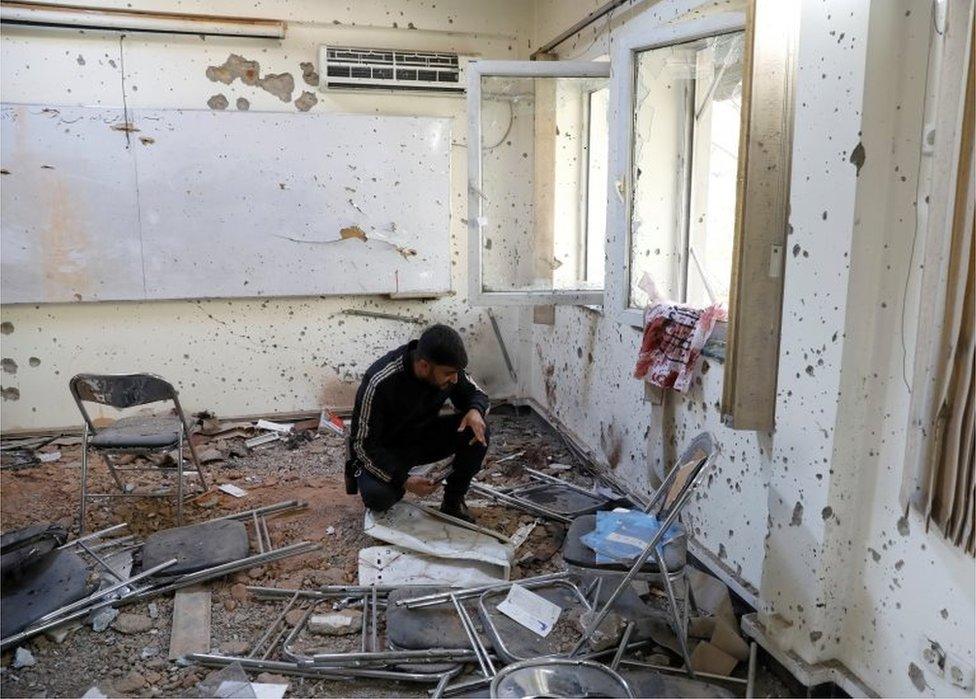 A damaged classroom after the attack at the university of Kabul