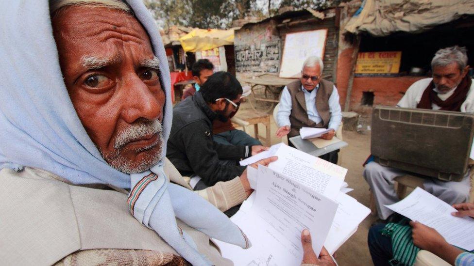 Mr Yadav speaking to villagers about RTI