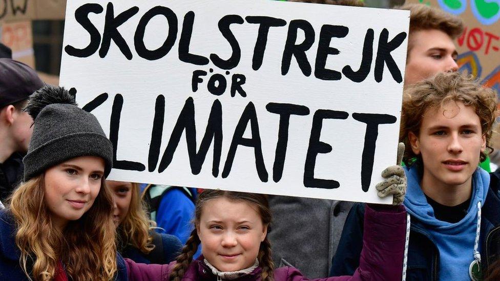 German climate activist Luisa Marie Neubauer (L) and Jakob Blasel (R) and Swedish climate activist Greta Thunberg at a protest in Berlin in 2019