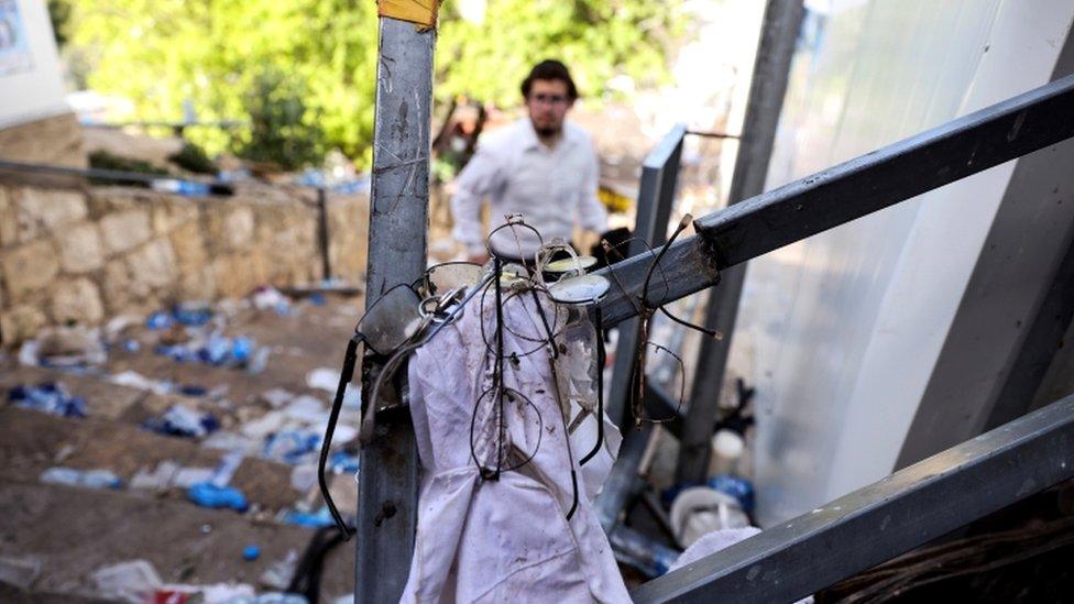 Image shows personal belongings left over after the crush