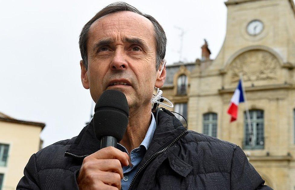 Mayor Robert Menard makes a statement on 19 January, 2016 outside the Beziers city hall