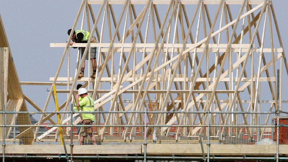 Builders at work on new homes