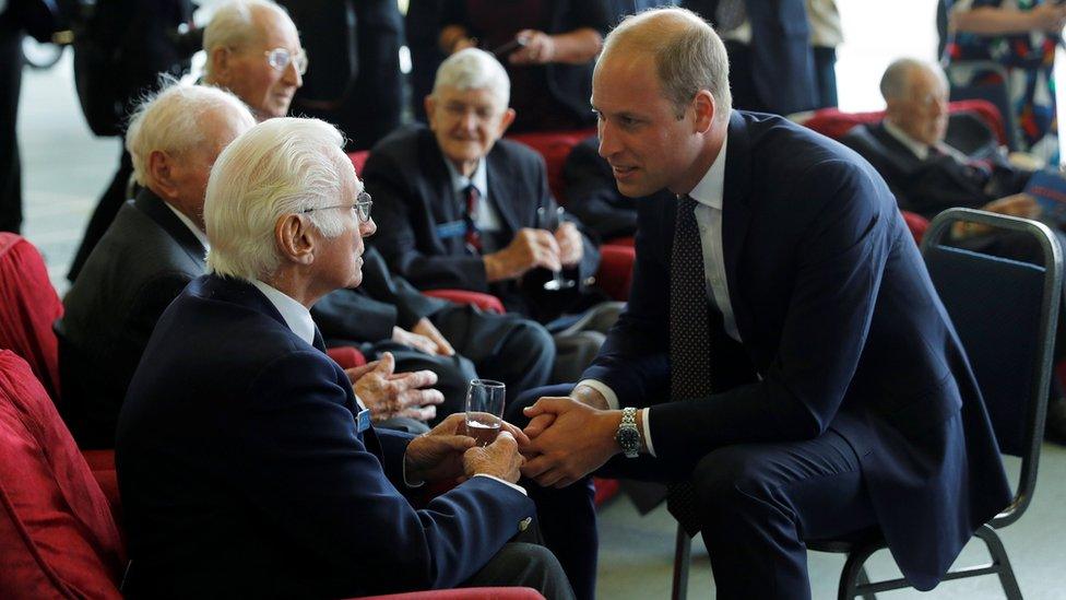 Prince William, Patron of the Battle of Britain Memorial Flight, speaks with veterans at RAF Coningsby