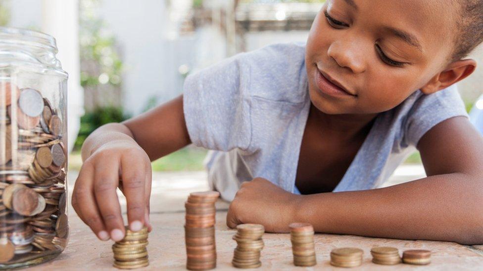 Child counting coins