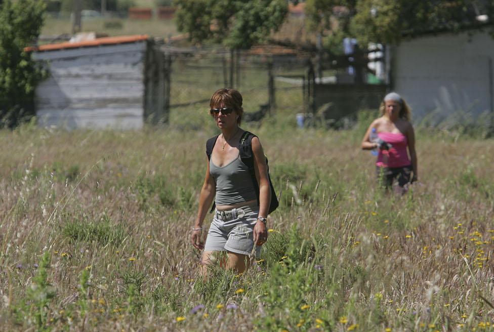 British tourists search for Madeleine McCann in wasteland on 8 May 2007 outside the Algarve resort of Praia da Luz in Portugal