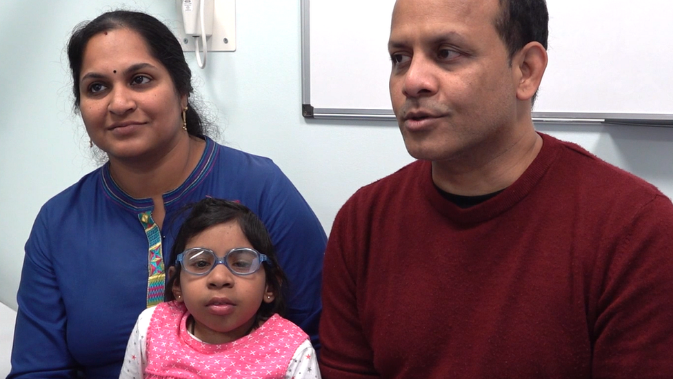 Aditi with her parents