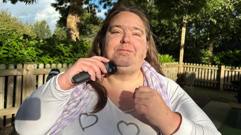 Annette shaving her facial hair off