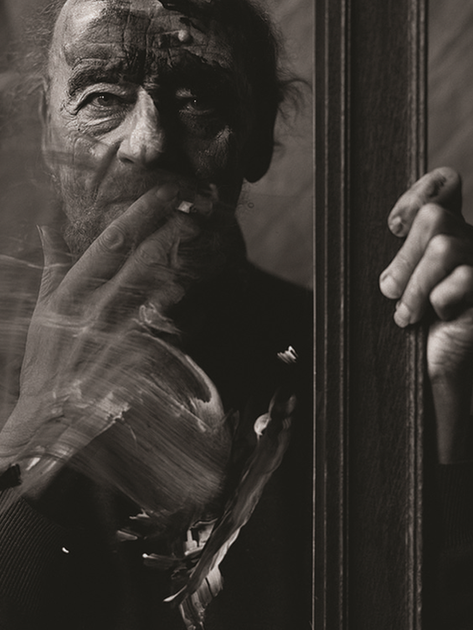 A photograph of Alan Tanner smoking