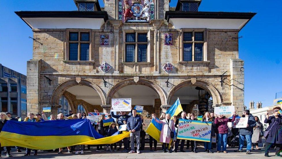 A rally taking place outside Cathedral Square in Peterborough on Sunday 27 February