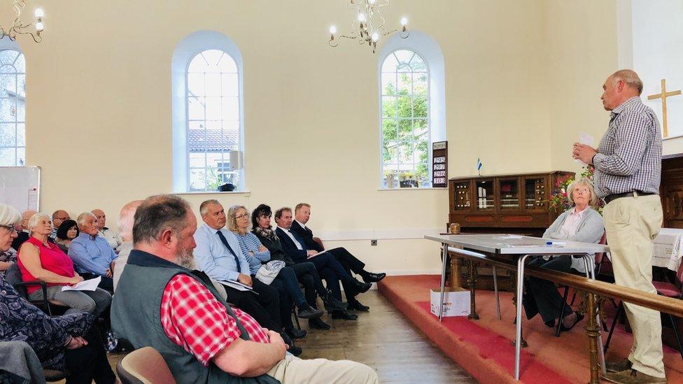 Audience at public meeting