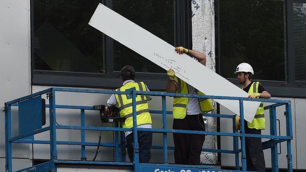 Cladding being removed from building in Manchester in 2017