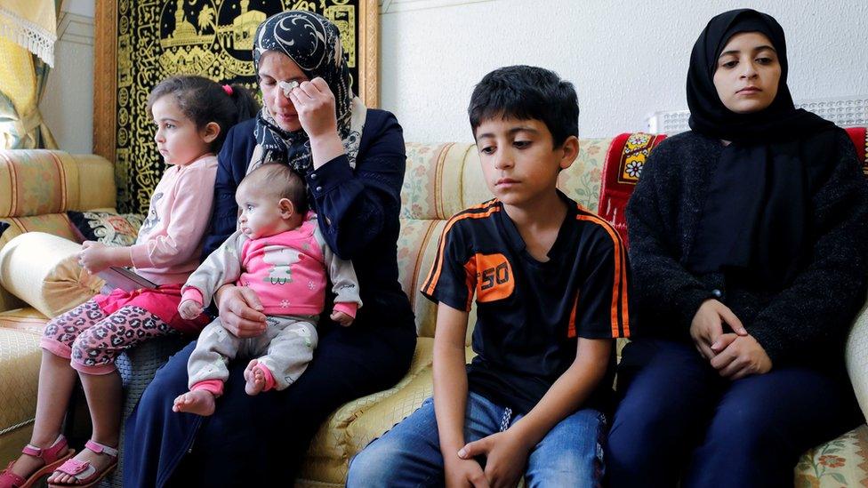 The wife and children of Palestinian activist Nizar Banat, who died while being arrested by Palestinian security forces near Hebron in the Israeli-occupied West Bank (24 June 2021)