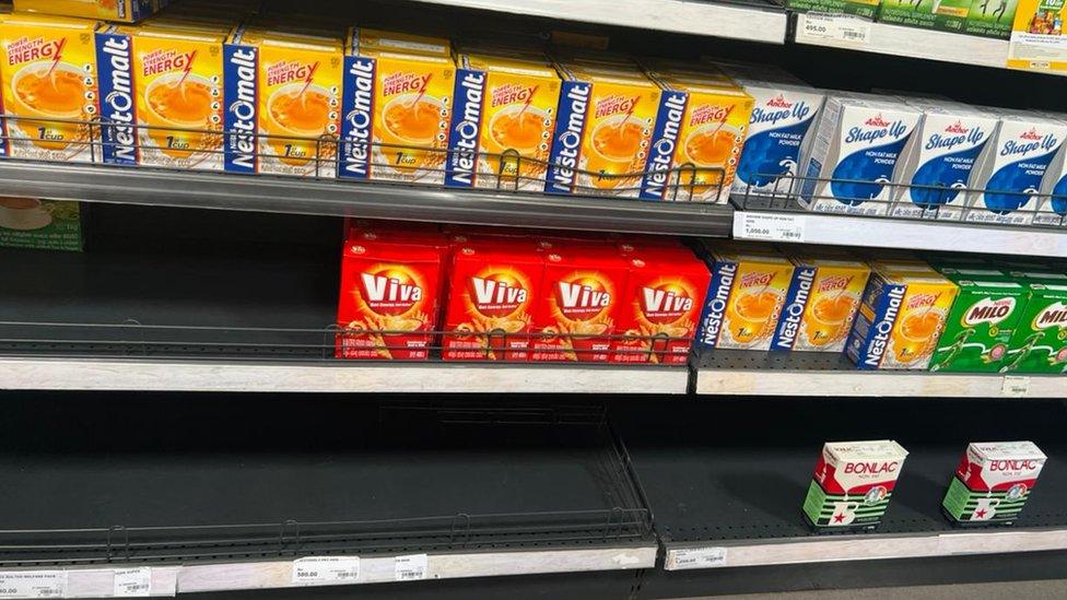 Shelves in the supermarket showing no powdered milk