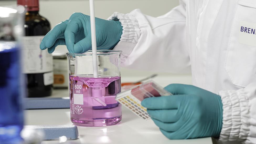 Woman mixing chemicals