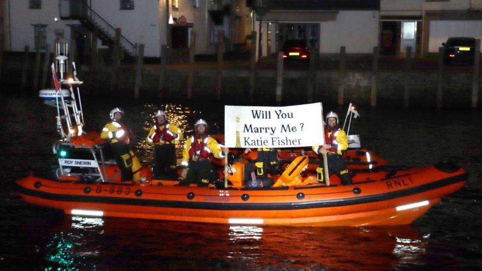 Looe RNLI with proposal banner