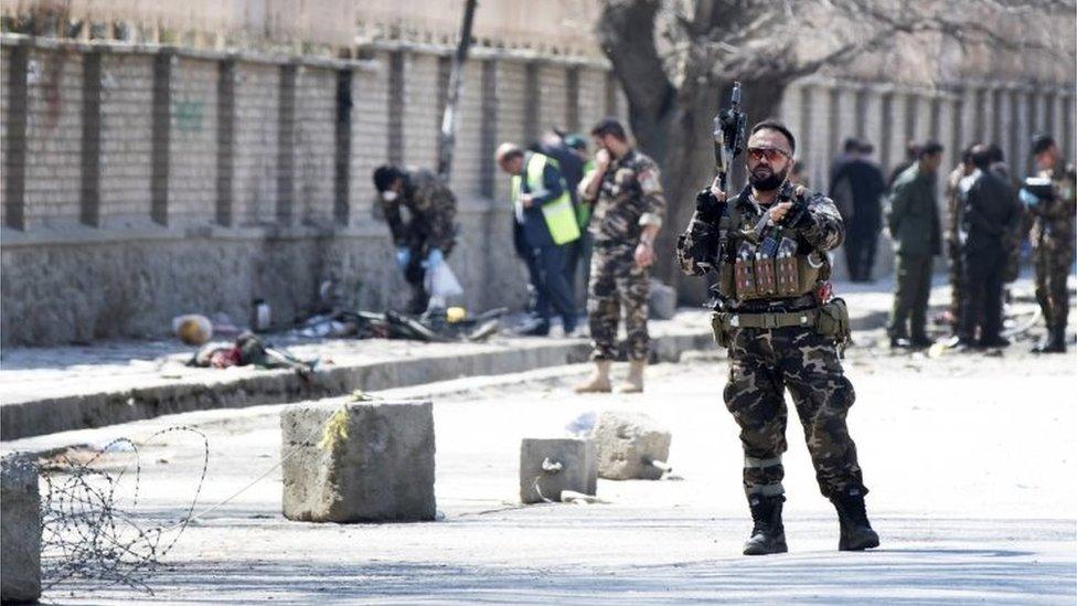 Afghan security officials inspect the scene of a suicide bomb blast that targeted a shrine visited by Shi"ite Muslims as the country observes the Nowruz Persian New Year, in Kabul, Afghanistan, 21 March 2018.