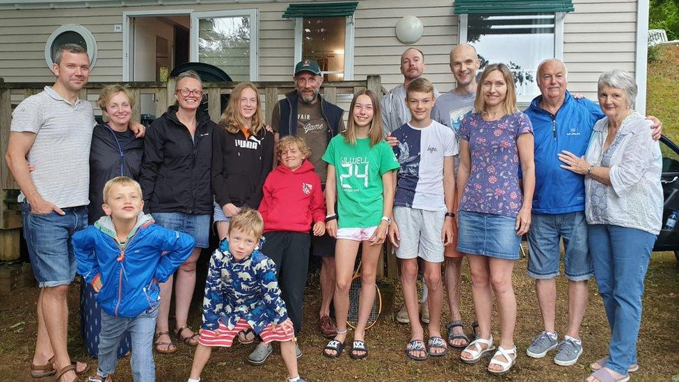 Tom (second from right) and his family