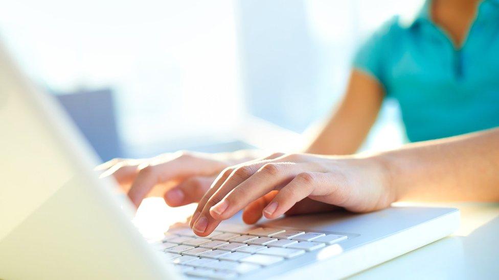 Teenager using a computer