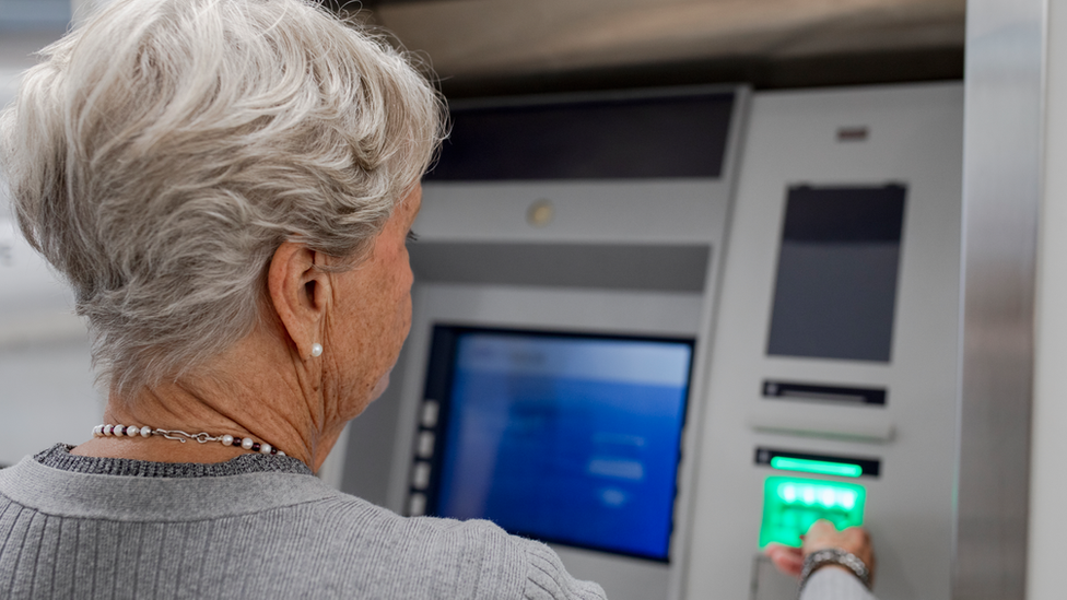 Woman at ATM