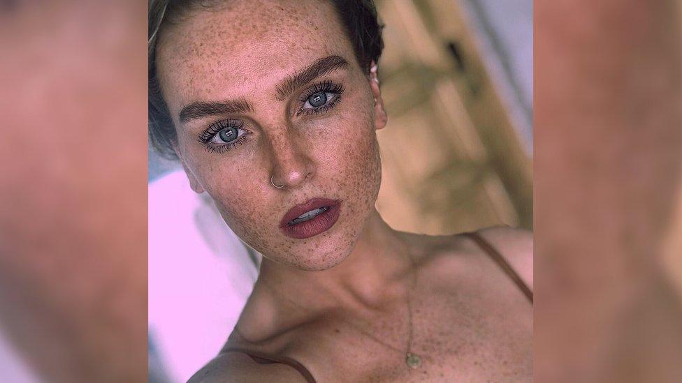 Close-up of Perrie showing the freckles on her face.