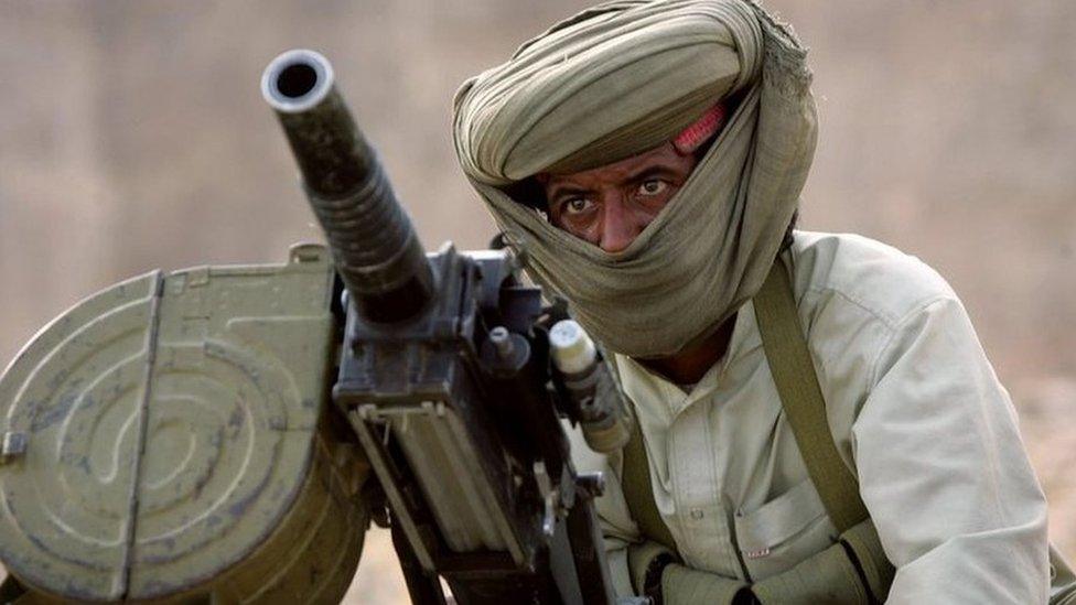 A Marri tribal guerrilla prepares to fire a grenade launcher at a Pakistani troop outpost January 31, 2006 near Kahan in the Pakistani province of Balochistan.