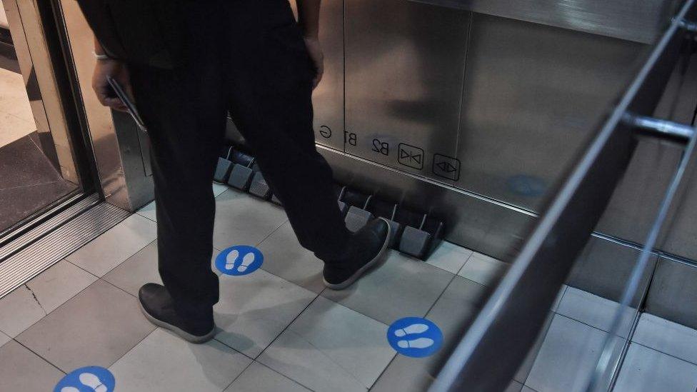 A foot pedal in an elevator in Thailand