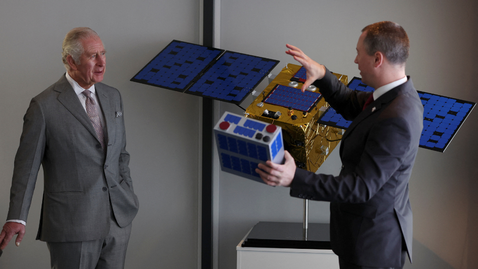 Britain's Prince Charles, Prince of Wales speaks to Head of Operations at Astroscale during his visit to the company in Harwell, January 31, 2022.