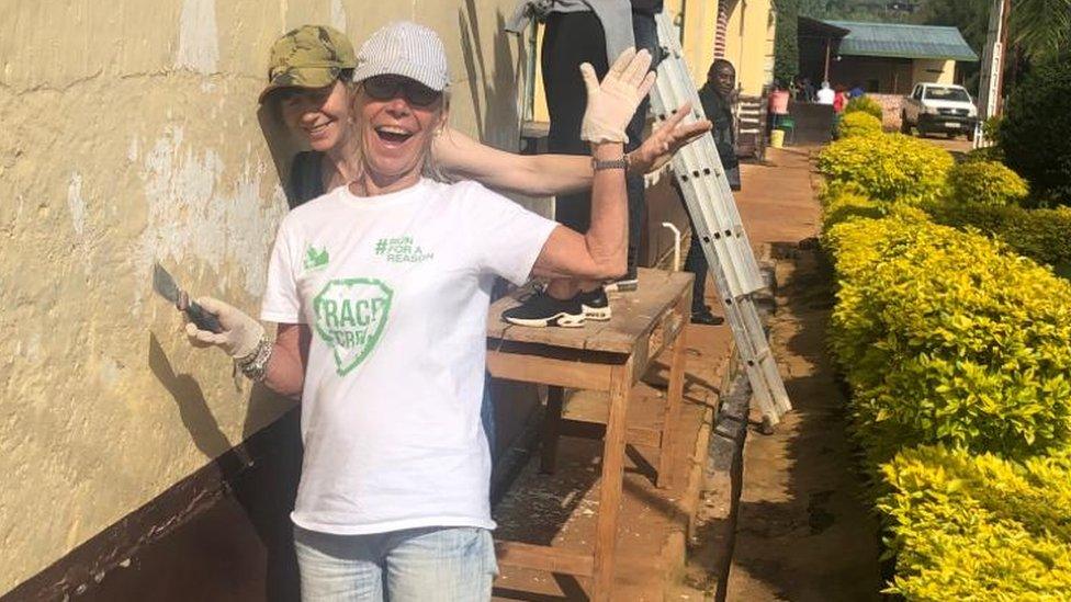 Volunteers painting school