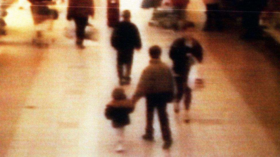 Bulger was led out of the shopping centre by Venables and Thompson