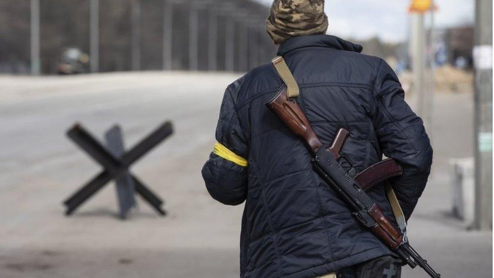 Fighters stands on a checkpoint in Kiev, Ukraine