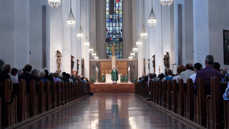 Cardinal Reinhard Marx speaks during memorial service for victims of the shooting on July 24, 2016 at the Frauenkirche church in Munich